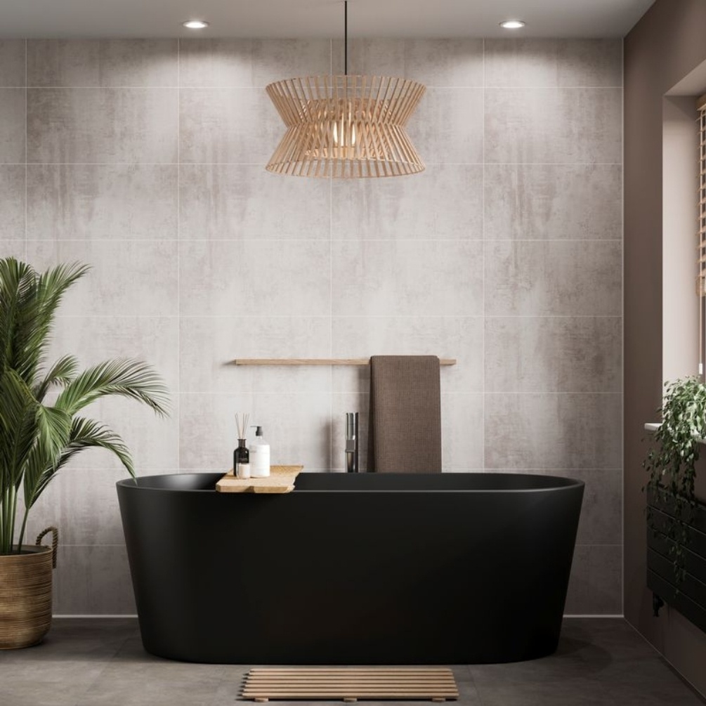 Lifestyle image of the Showerwall Laminate Concrete 2400mm x 600mm Rectangle Tile Effect Wall Panel - SWT09 installed behind a freestanding black bathtub